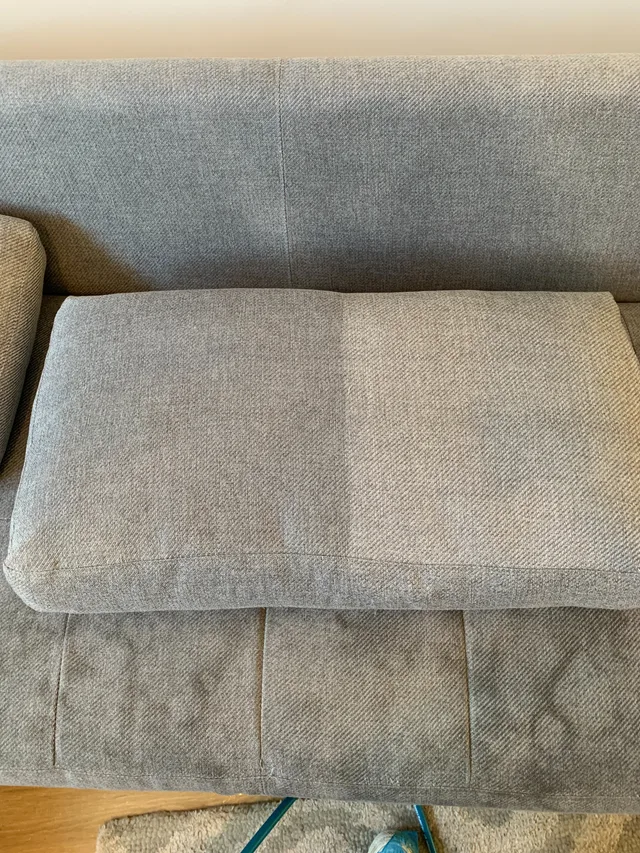 Upholstery cleaning on a modern sofa